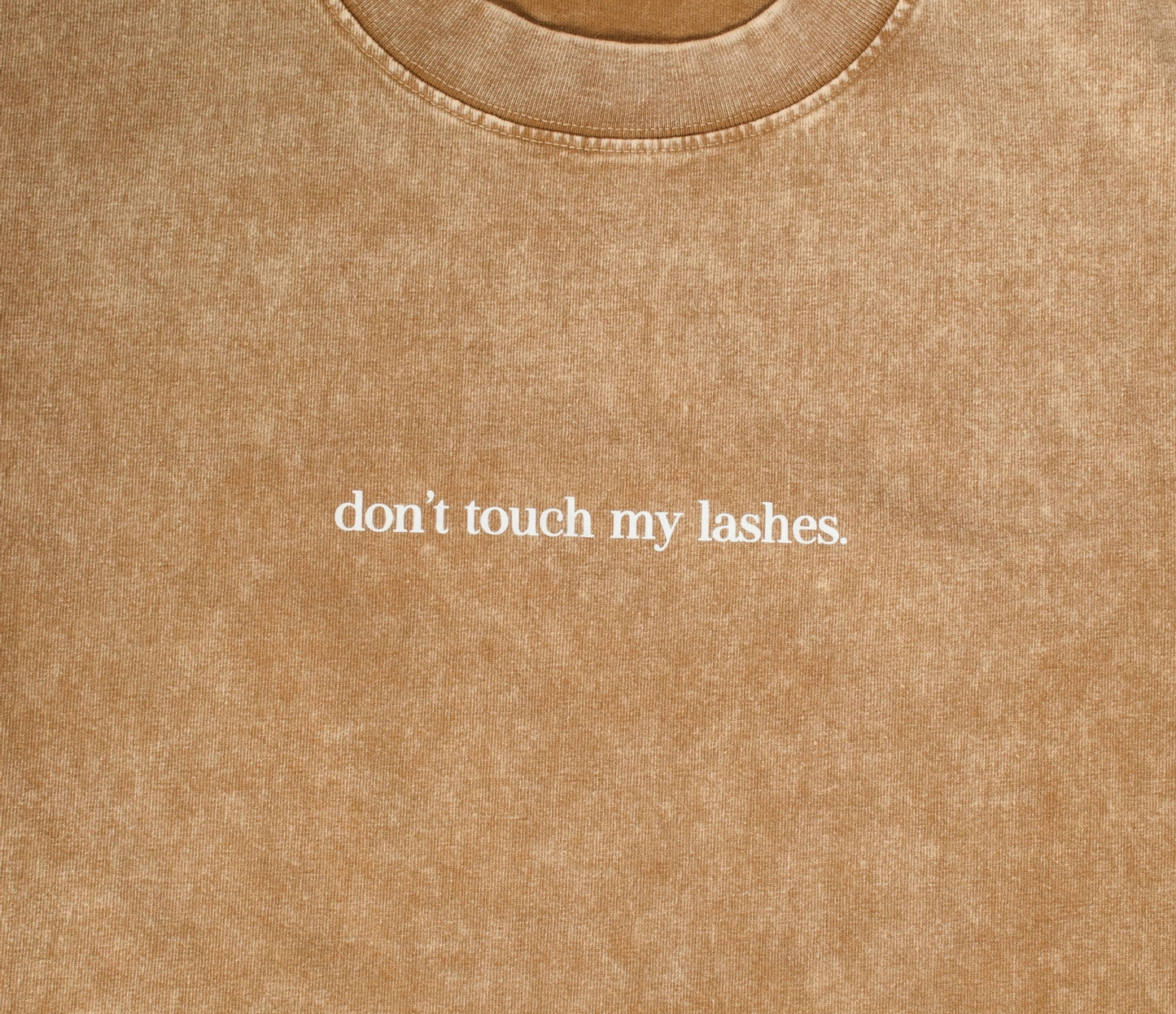 “don’t touch my lashes.” Acid wash tee